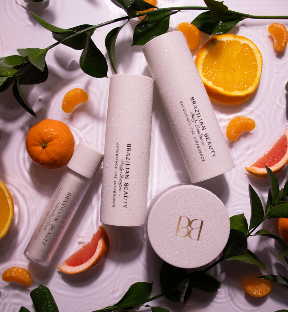 Brazilian Beauty Daily Bundle products with fruits laying in a water tray. 